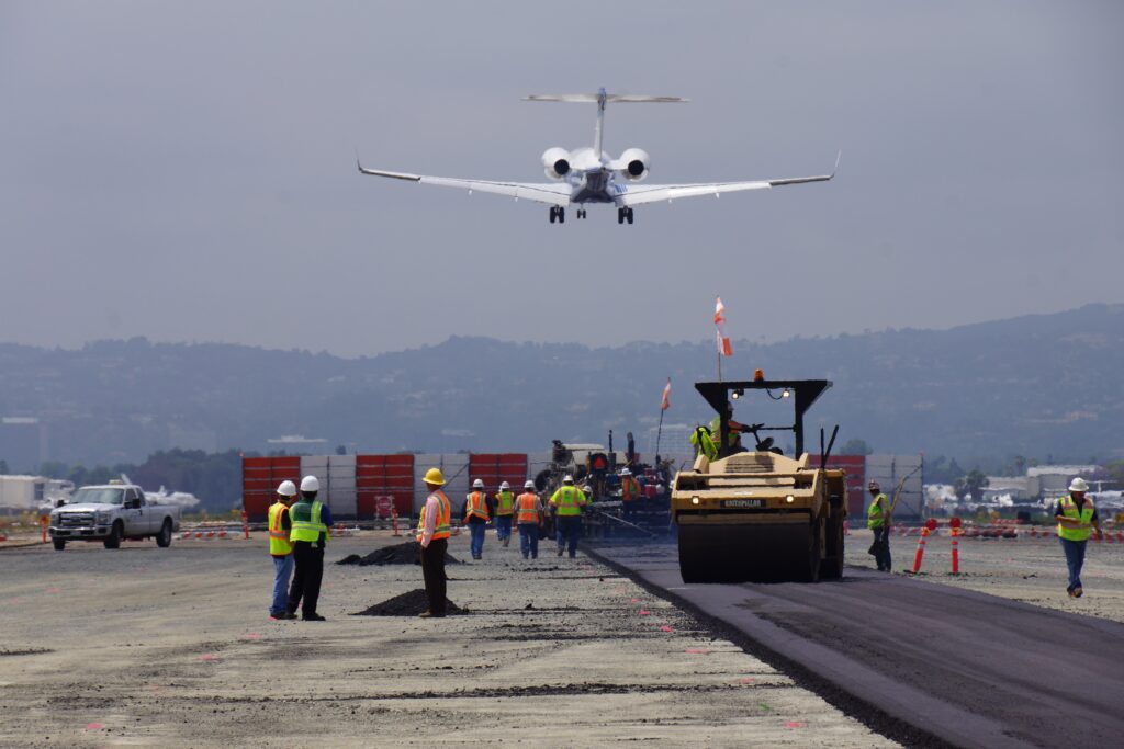 Photo: Plane taking off during runway construction